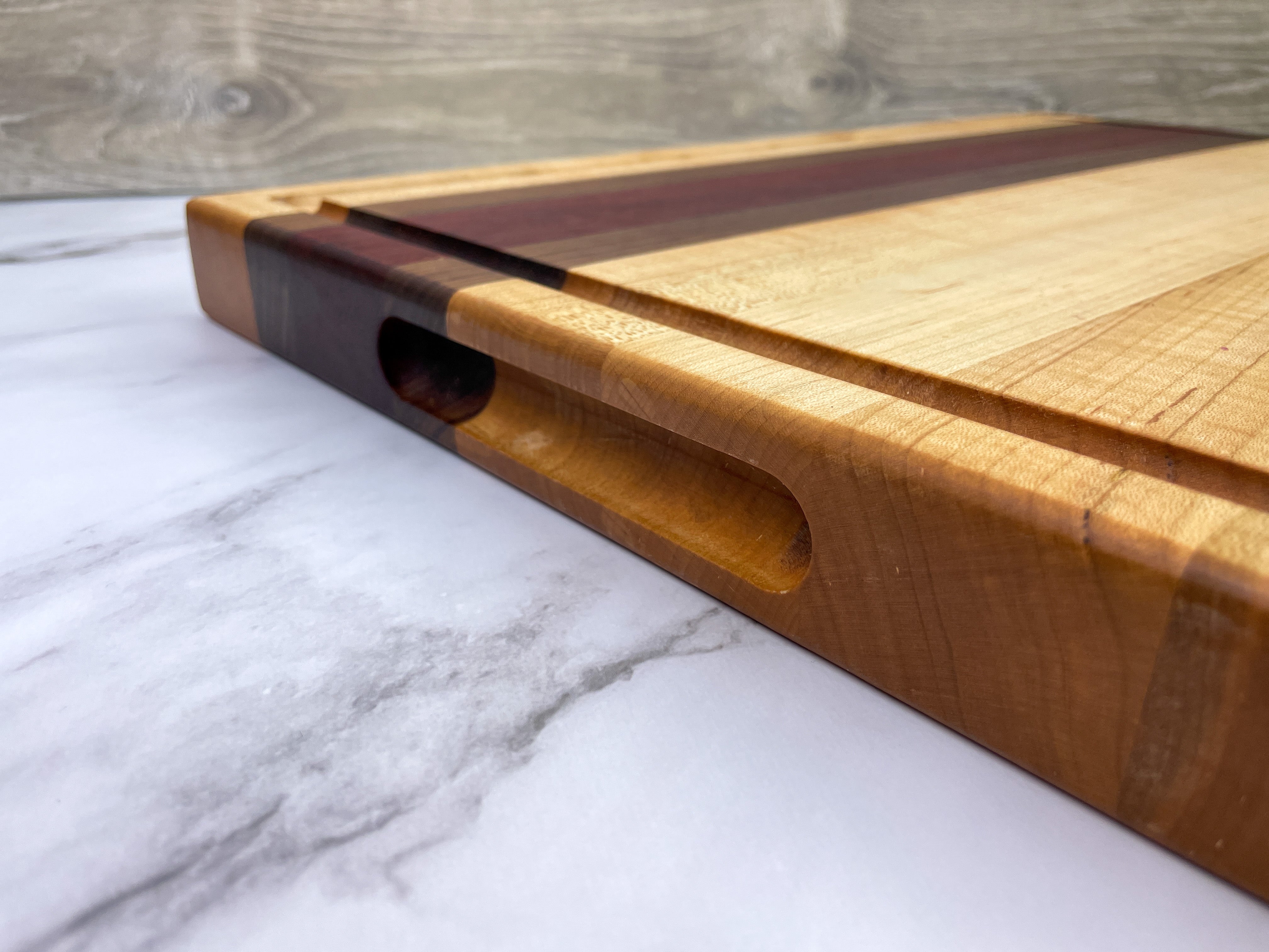 Bloodwood, Maple, and Walnut end 2024 grain cutting board